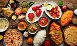 Indian food with biryani curry naan samosas and traditional dishes